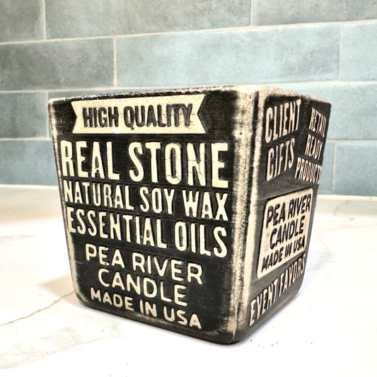 Custom soy candle in concrete vessels for retail by Pea River Candle Company